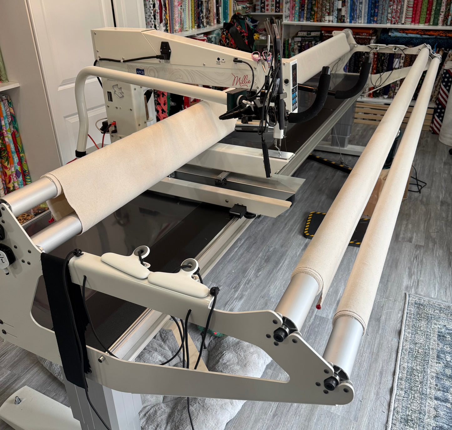 "Professional long arm quilting machine creating custom quilting design on quilts anywhere from small to large"