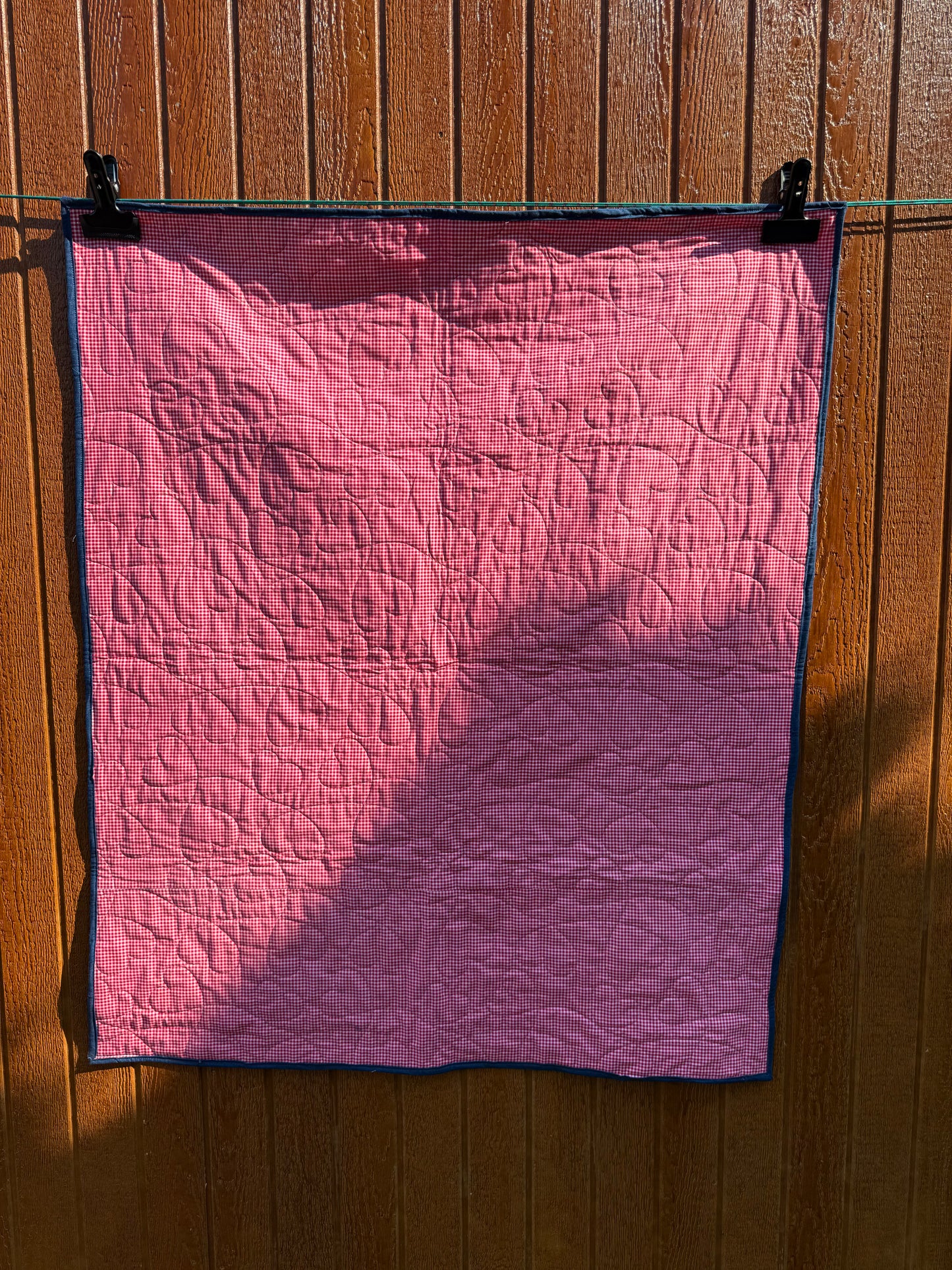 "Handmade quilt with traditional piecing and professional quilting finish"