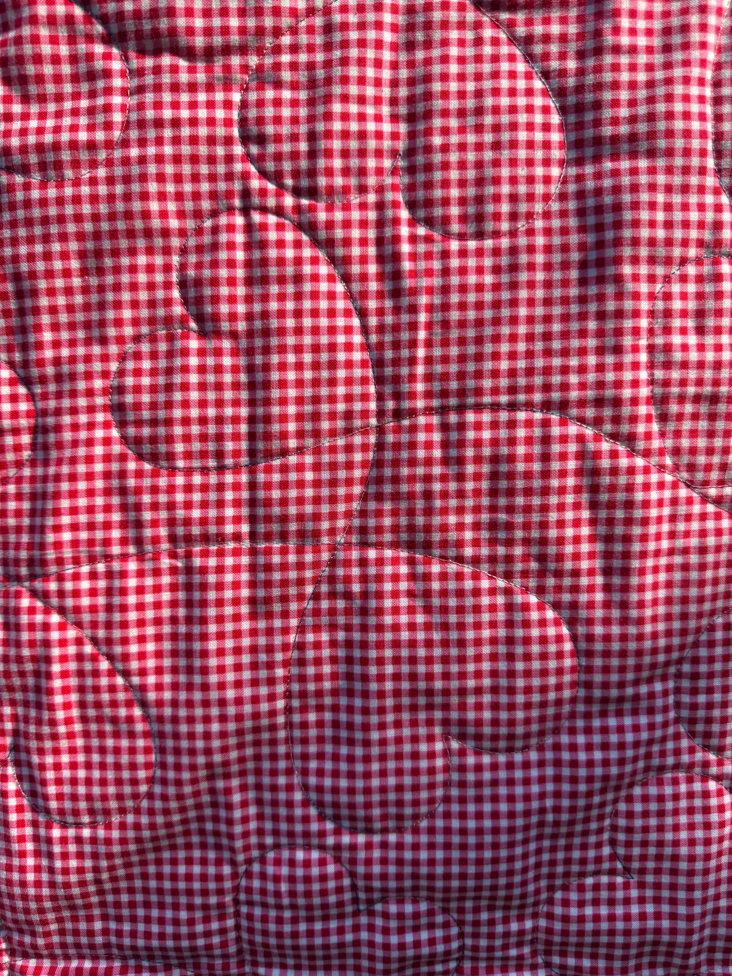 "Handmade quilt with traditional piecing and professional quilting finish"