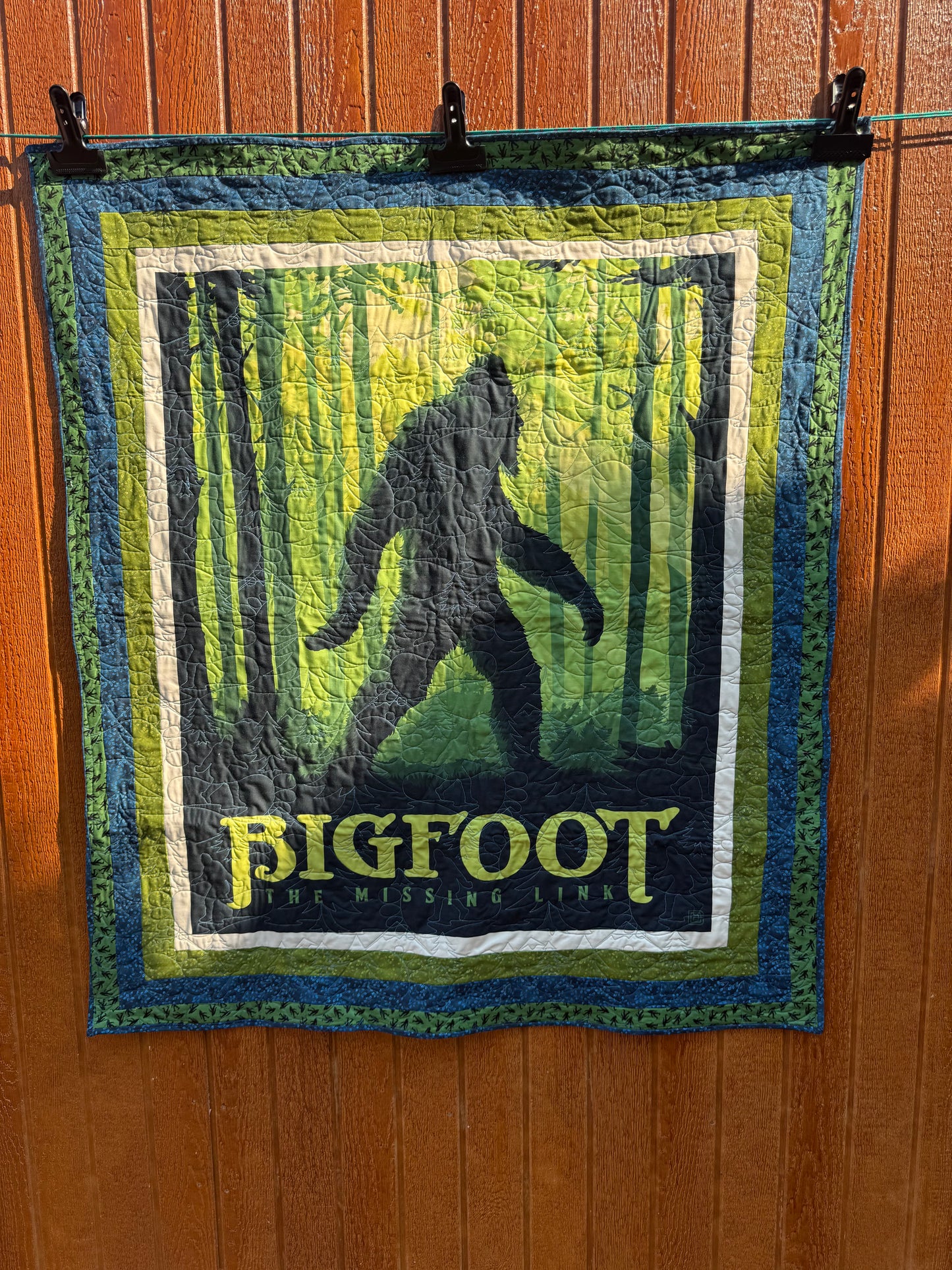 "Handmade quilt with traditional piecing and professional quilting finish"