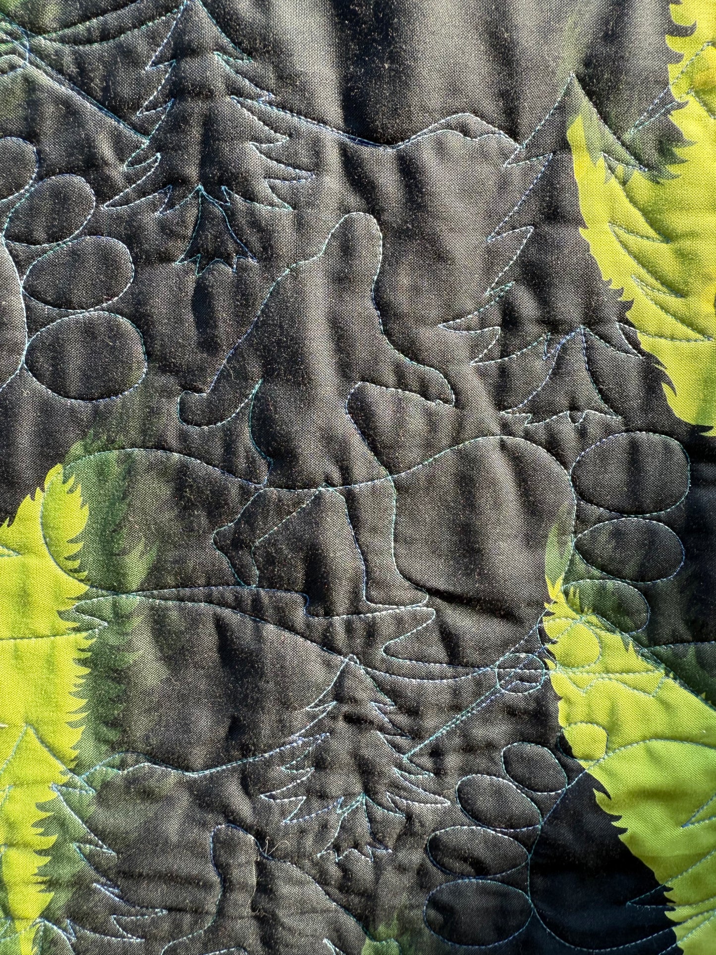 "Handmade quilt with traditional piecing and professional quilting finish"