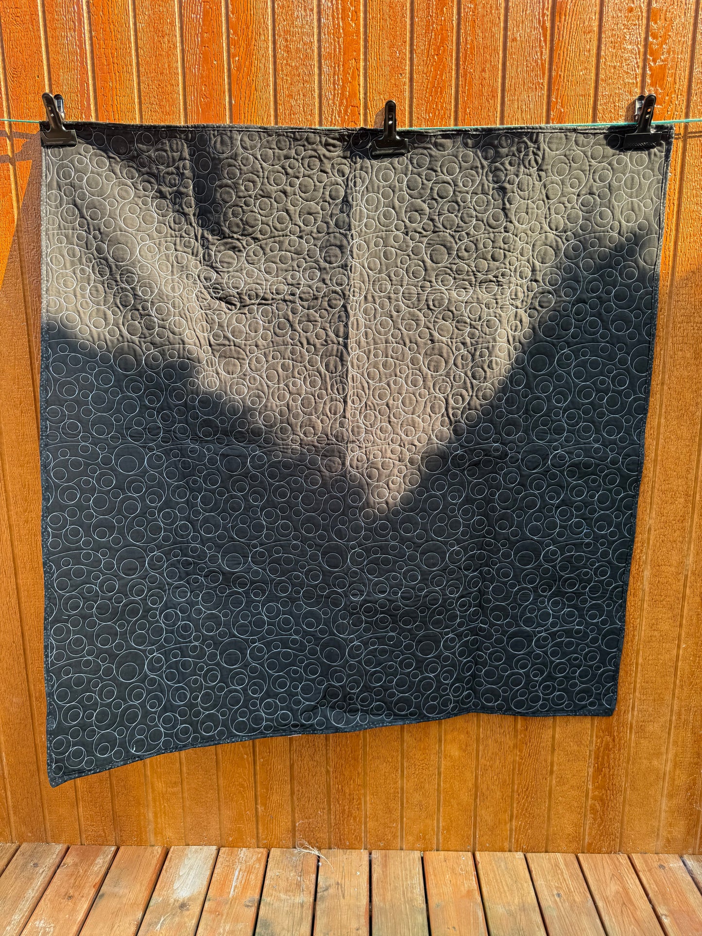 "Handmade quilt with traditional piecing and professional quilting finish"