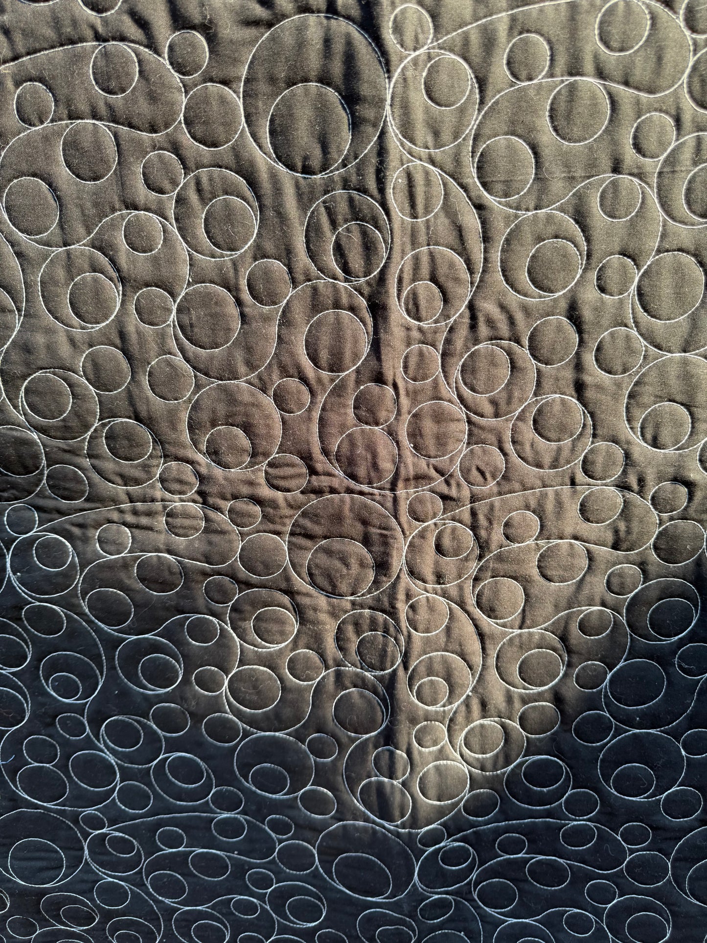 "Handmade quilt with traditional piecing and professional quilting finish"