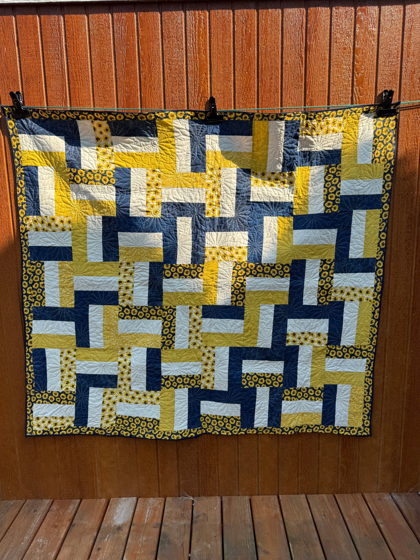 "Handmade quilt with traditional piecing and professional quilting finish"
