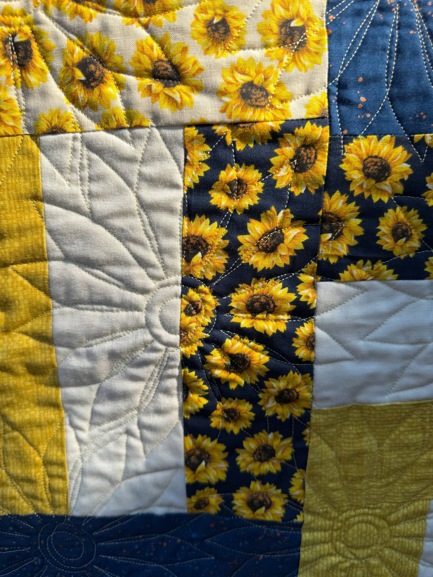 "Handmade quilt with traditional piecing and professional quilting finish"