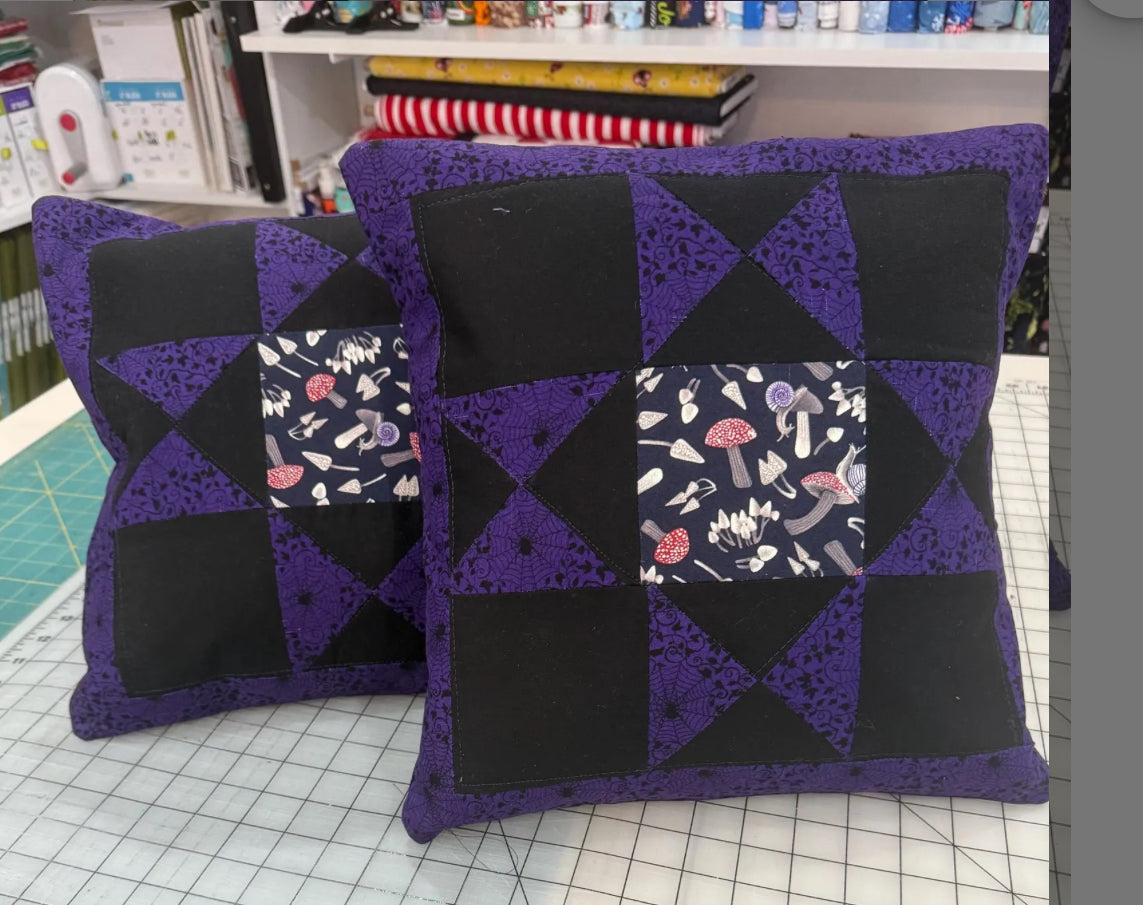 "Handmade quilted throw pillow with decorative fabric and professional finishing"