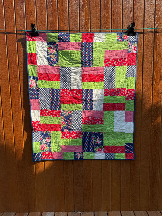 "Handmade quilt with traditional piecing and professional quilting finish"
