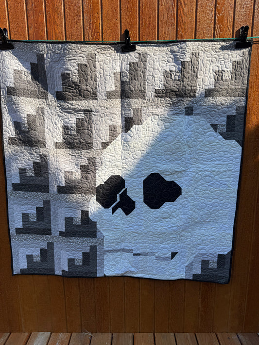 "Handmade quilt with traditional piecing and professional quilting finish"
