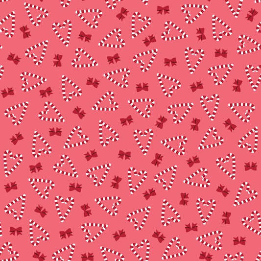 Christmas themed pattern of candy canes, hearts, and bows on a pink background
